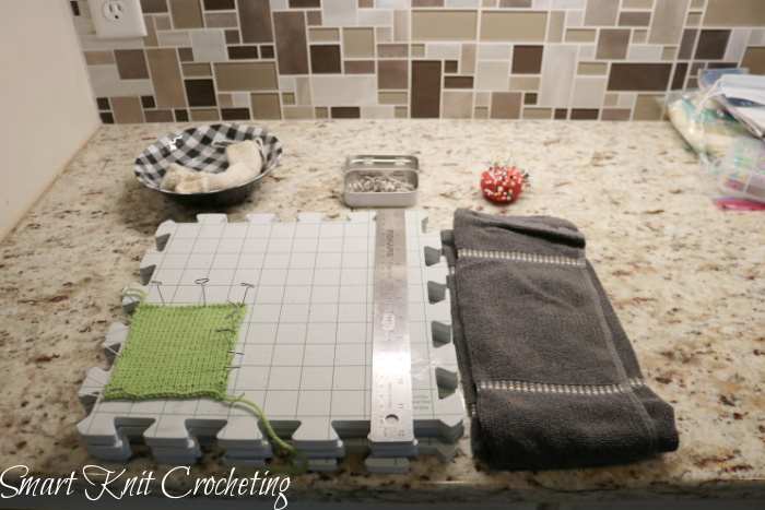 Blocking supplies: foam mats with grid, ruler, pins, towel