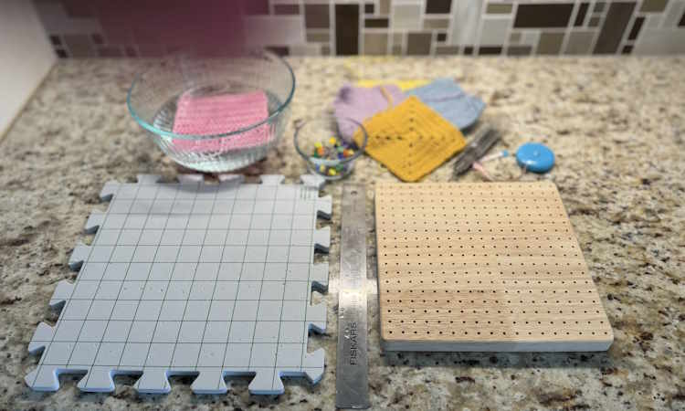 Crochet piece pinned on blocking mats with rust-proof pins