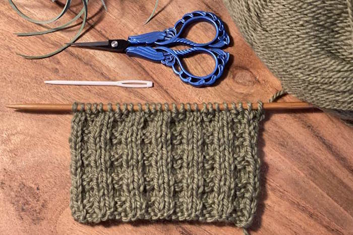 Close-up knit swatch showing textured thermal stitch